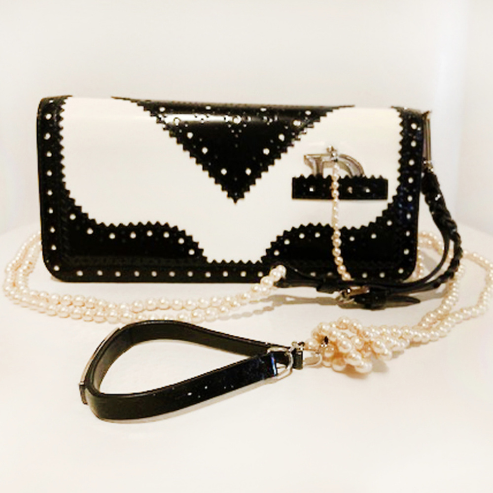 Christian Dior patent D'Trick shoulder bag.